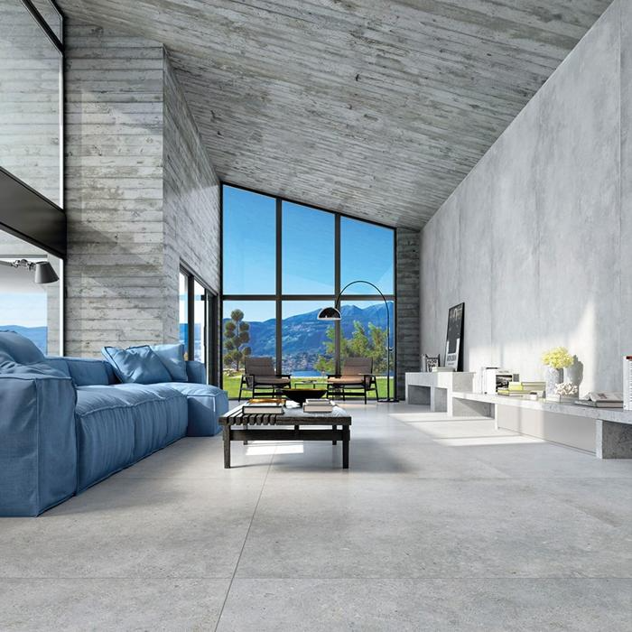 Spacious living room with concrete floor tiles