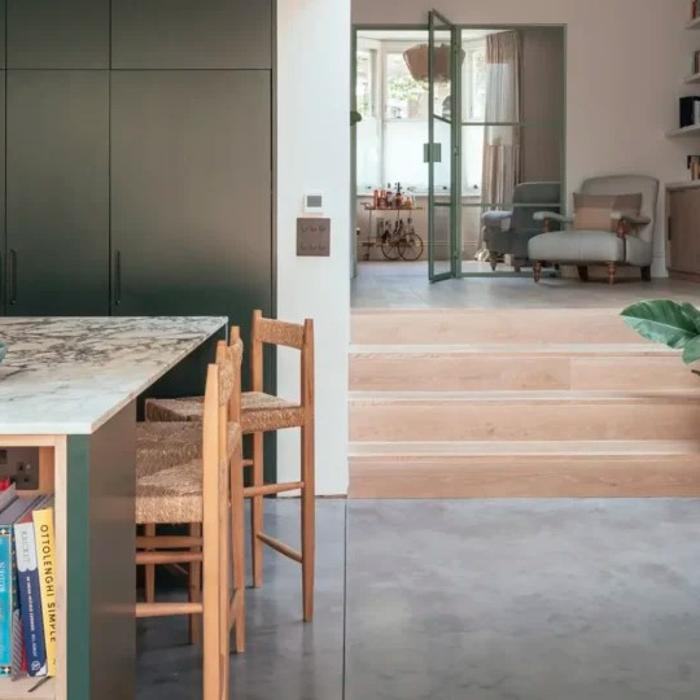 Modern kitchen and living space with polished concrete flooring