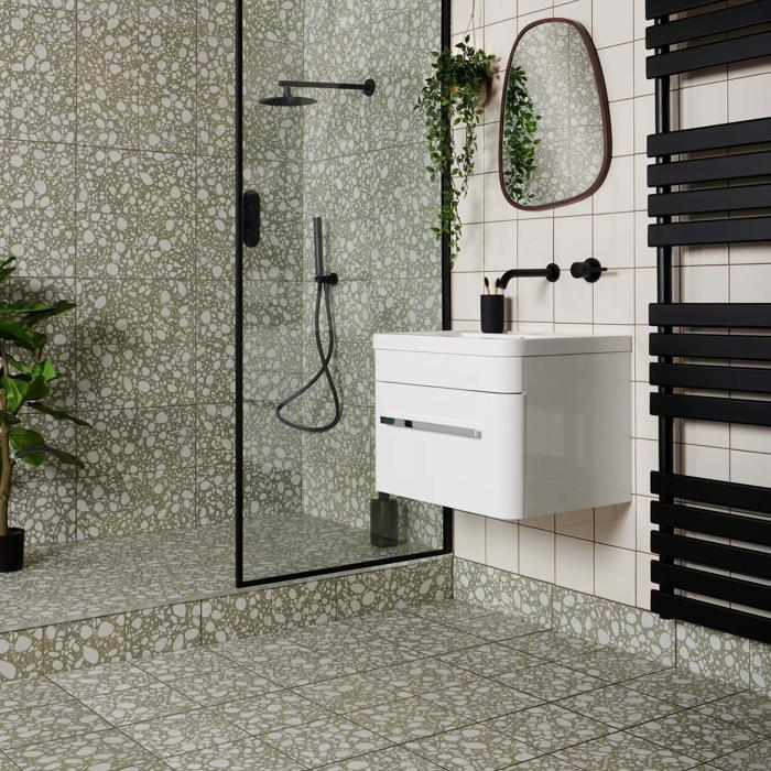 Bright bathroom with green terrazzo tiles and black fixtures