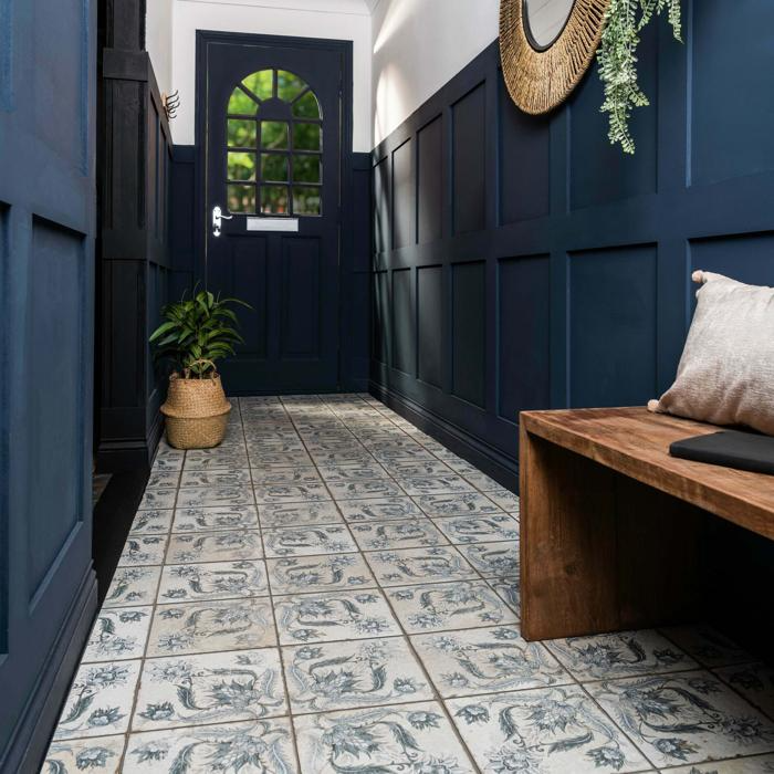 Blue and white patterned tiles adorn a cheerful entryway