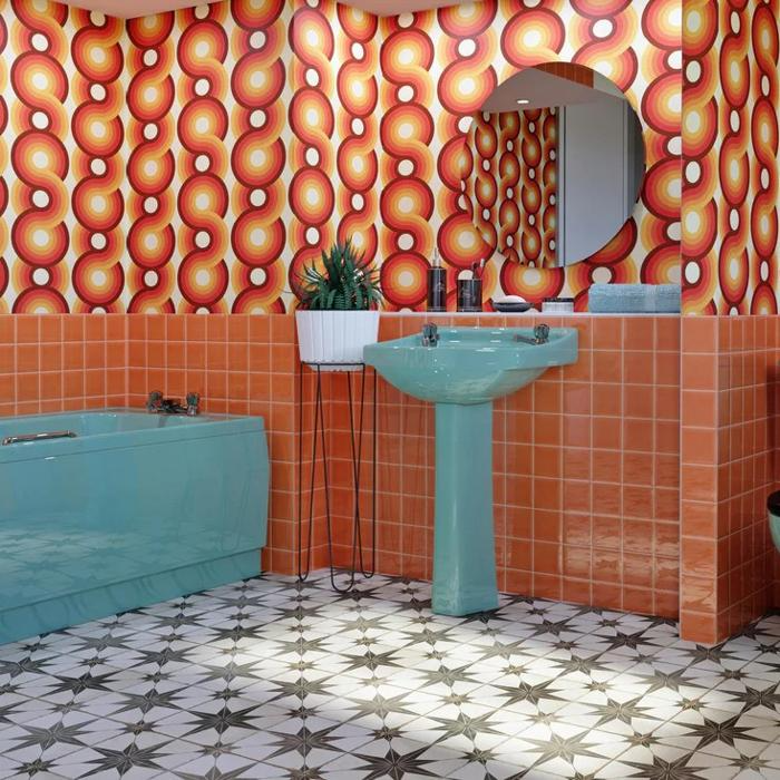 Retro bathroom with patterned wallpaper and orange tiles