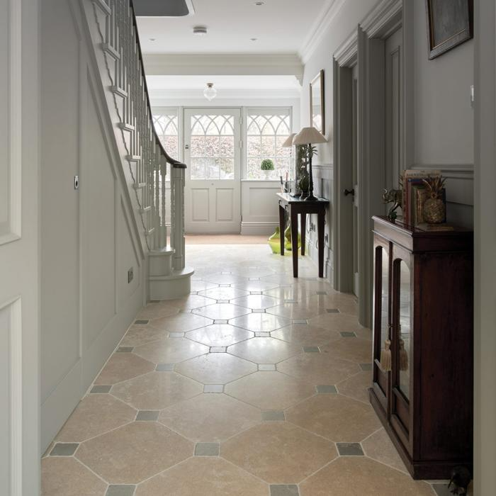 Elegant hallway with patterned limestone floor tiles