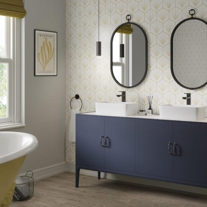 Bathroom with patterned wall tiles and a double vanity