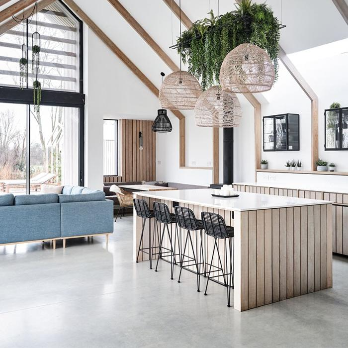 Open-plan kitchen and living area with concrete flooring