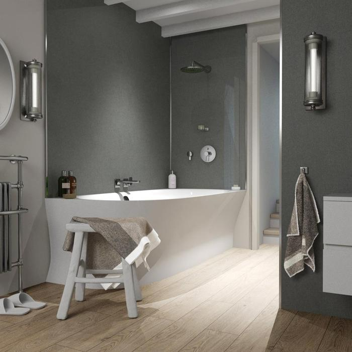 Modern bathroom with white tub and grey walls