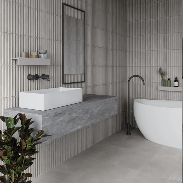 Minimalist bathroom with textured grey walls and white basin