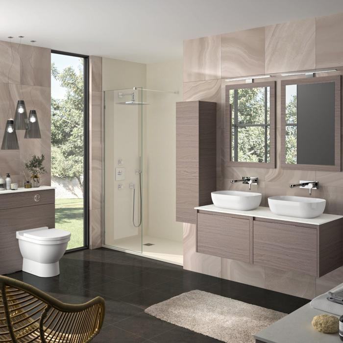 Beige and brown tiles, double sink, and glass shower in contemporary bathroom