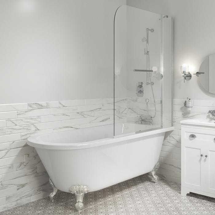 Gleaming tub with white marble wall tiles and patterned floor