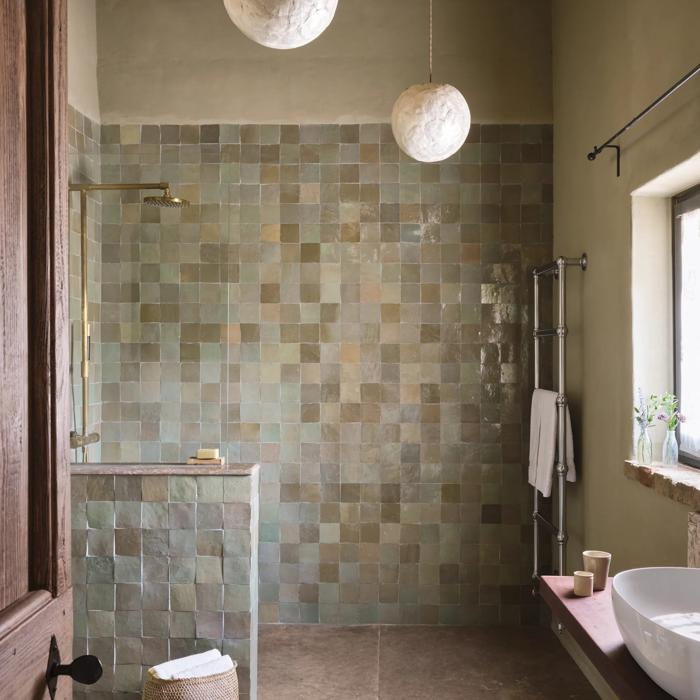 Rustic walk-in shower with mosaic tiles and wooden beams