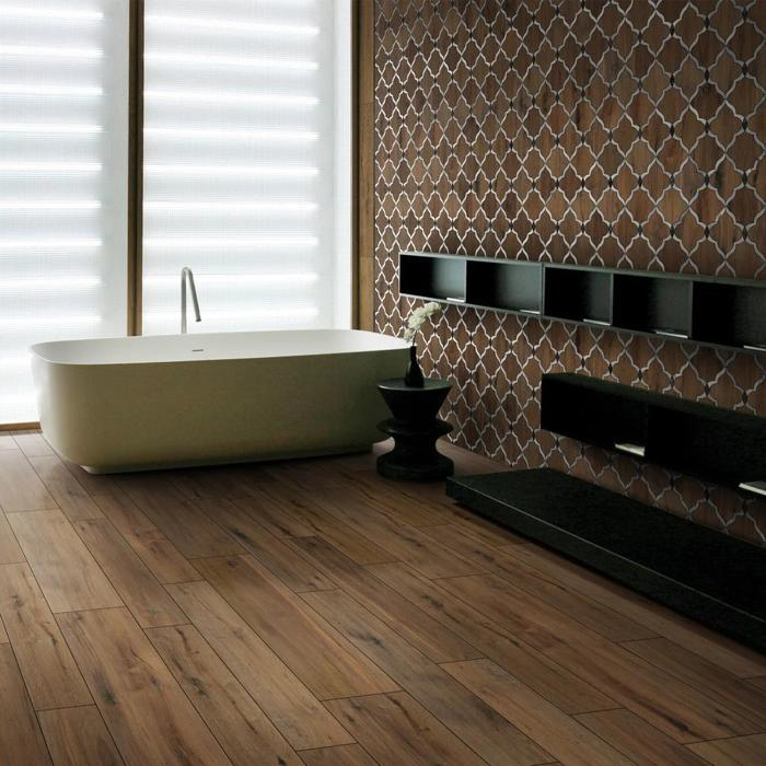 Modern bathroom with wood flooring and patterned feature wall