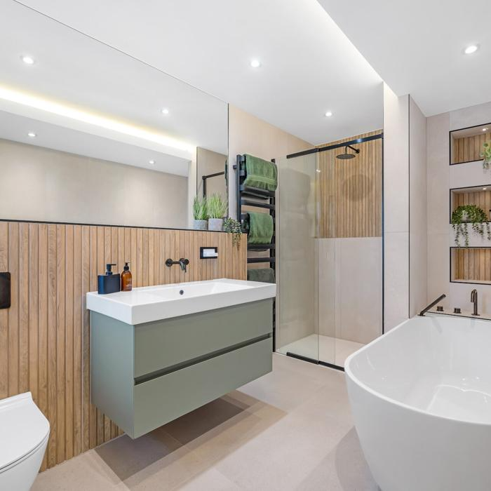 Contemporary bathroom with wood effect tiles and green accents