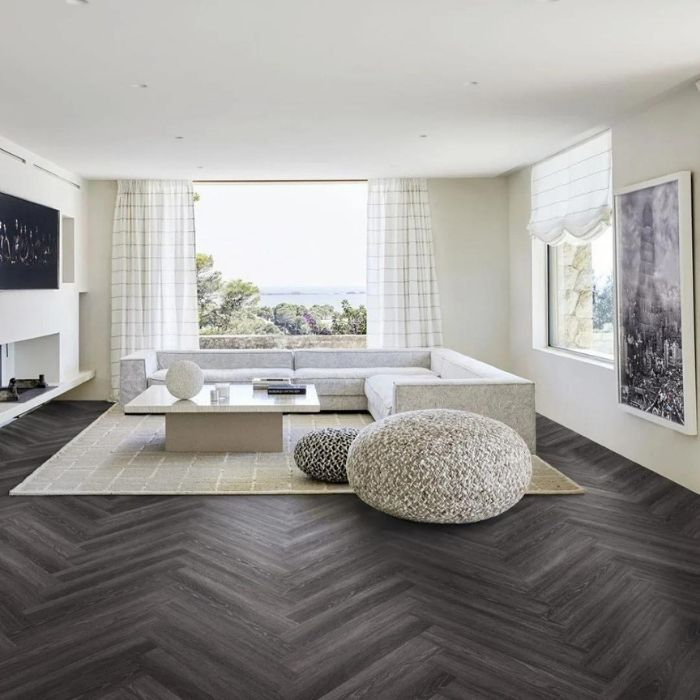 Modern living room with dark herringbone flooring