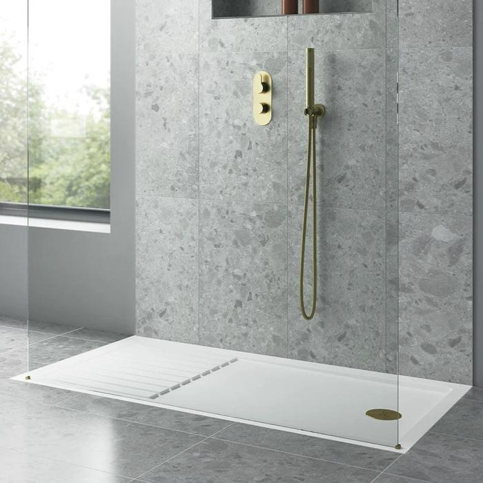 Minimalist walk-in shower with grey terrazzo tiles