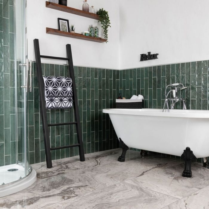 Bathroom with green subway wall tiles and freestanding tub