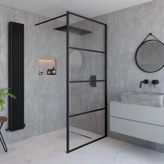 Industrial-style walk-in shower with black frame and grey tiles