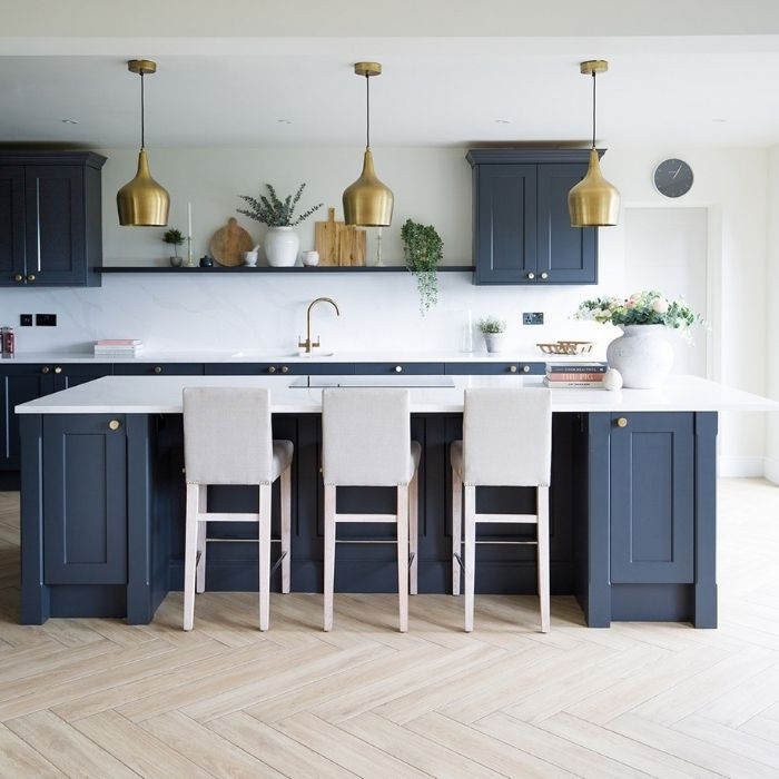 Modern kitchen with light herringbone flooring