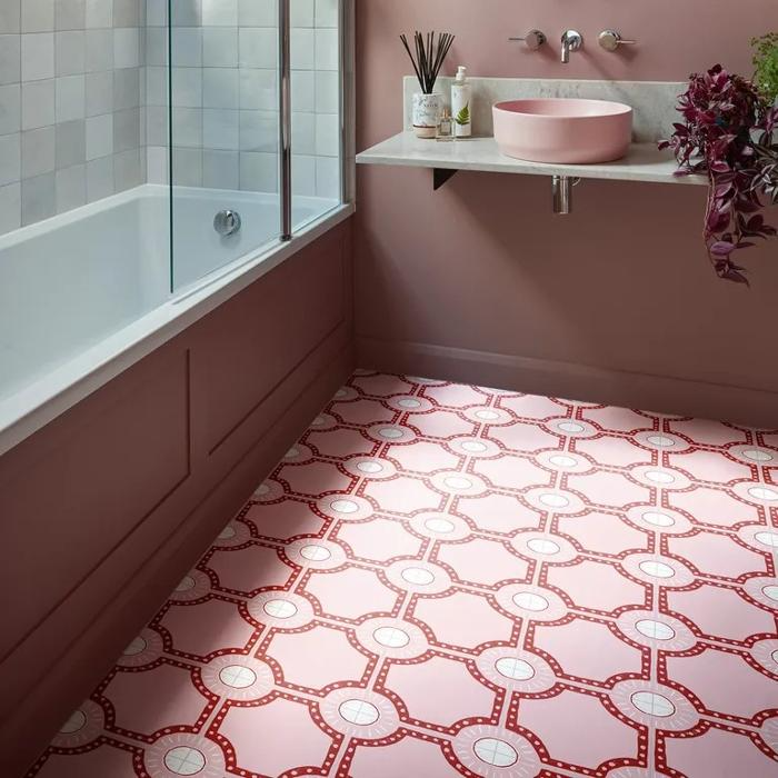 Small ensuite with decorative pink tiles