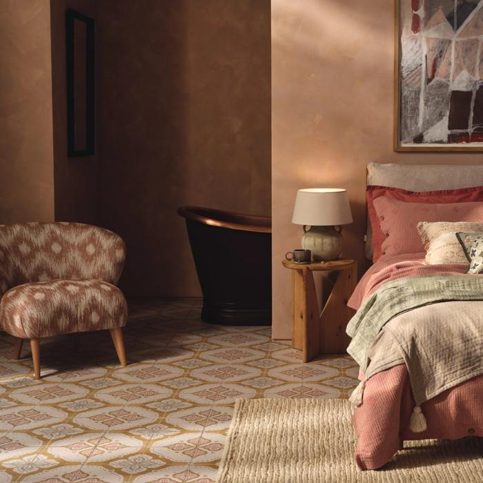 Warm patterned floor tiles in cosy bedroom