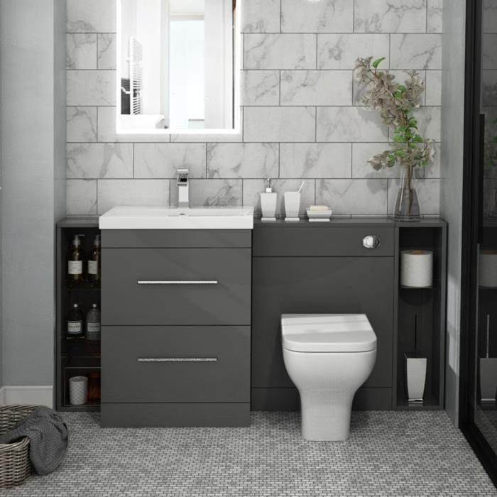 Light grey mosaic floor tiles in a small bathroom