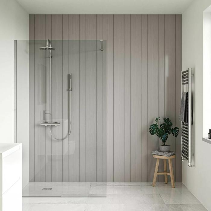 Sunny walk-in shower with grey panelled walls