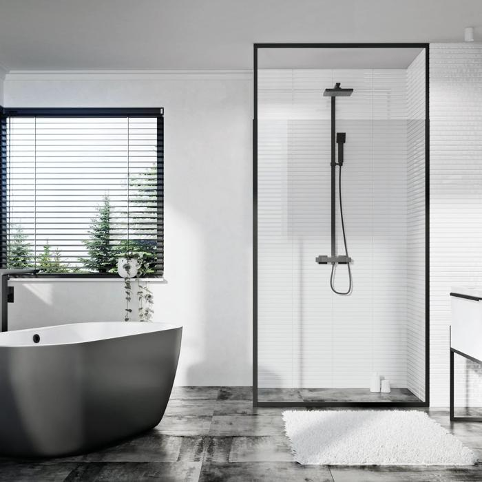 Contemporary bathroom with black freestanding tub and marble flooring