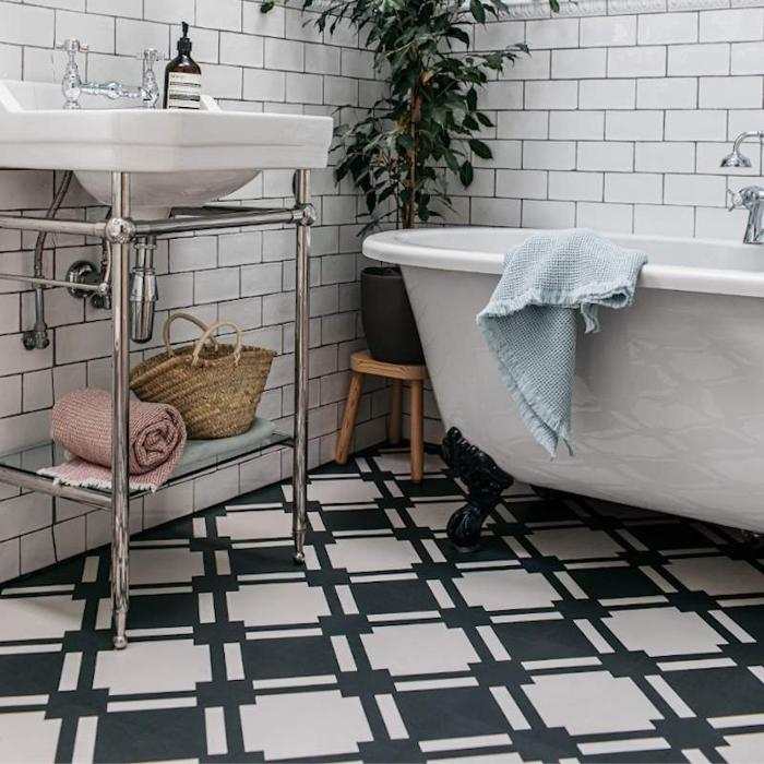 Diamond-patterned monochrome tiles adorn a modern ensuite