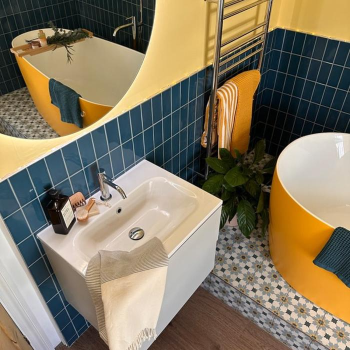 Yellow and blue bathroom with decorative tiles