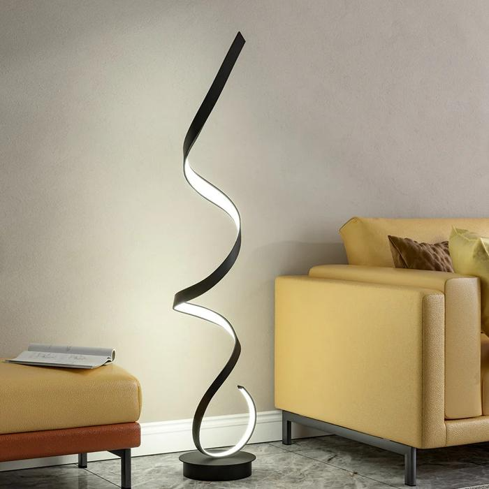 Black spiral floor lamp beside yellow sofa