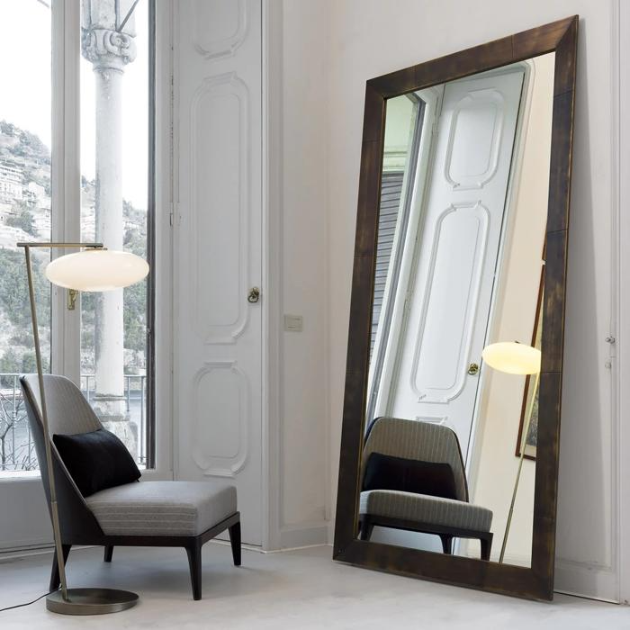 Large oak-framed mirror in a modern room