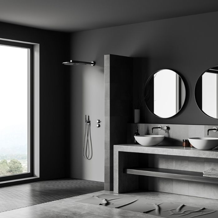 Minimalist bathroom with grey and black tiles and large window