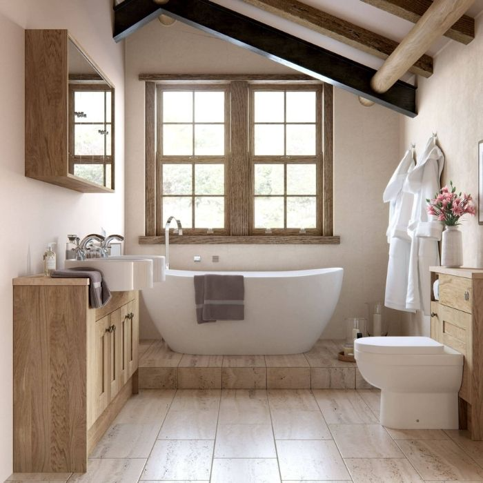 Country bathroom with exposed beams and wooden cabinets