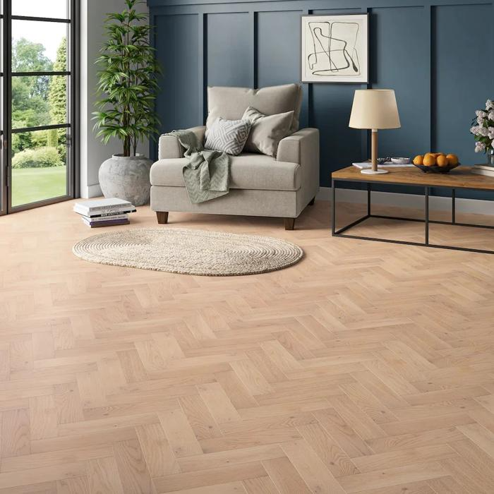 Herringbone solid oak flooring beneath a stylish living room