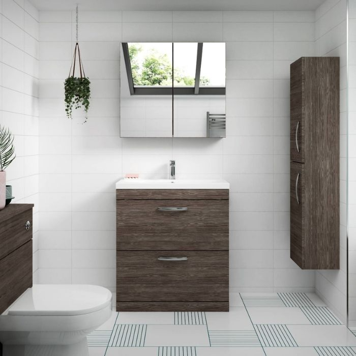 Minimalist bathroom with wood-effect cabinets and geometric floor tiles