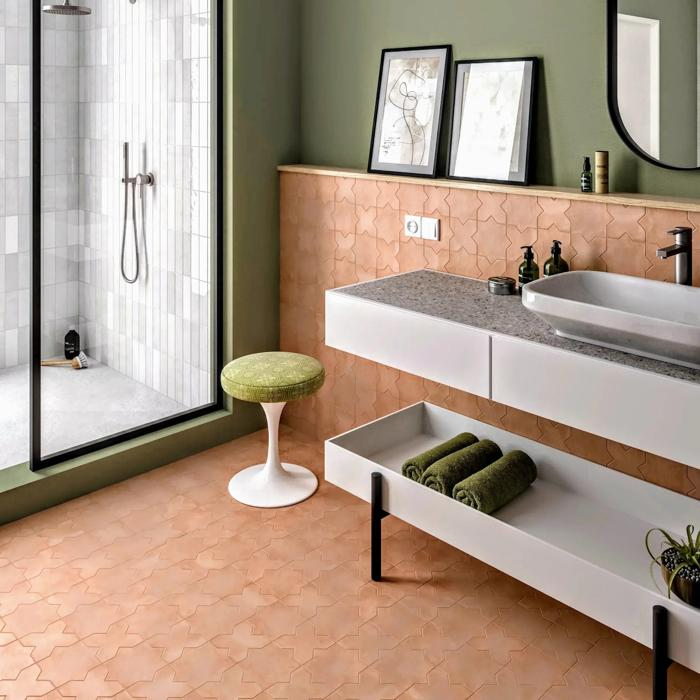 Ensuite with terracotta tiles and white vanity