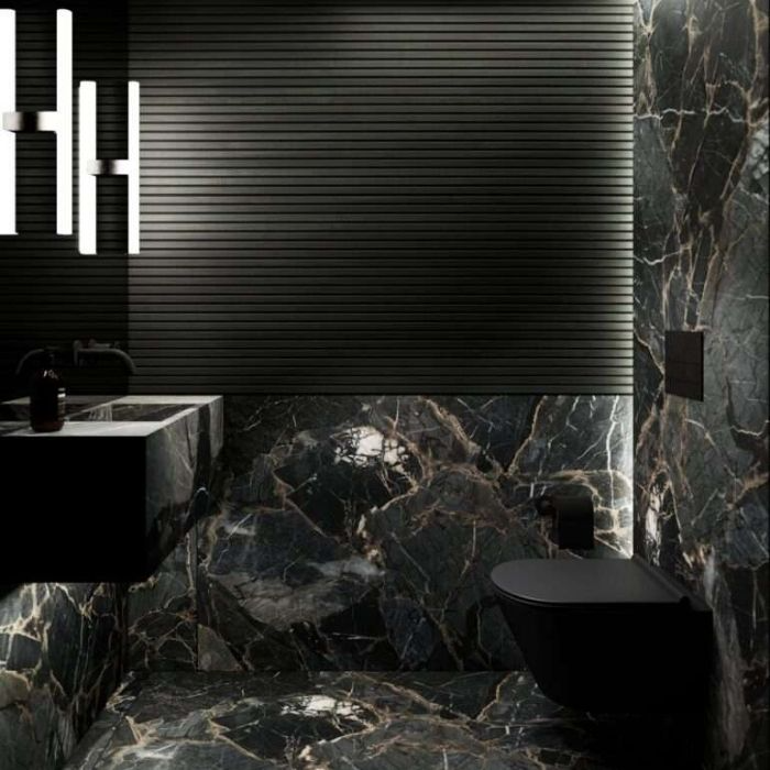 Luxurious bathroom with black marble tiles and modern fixtures