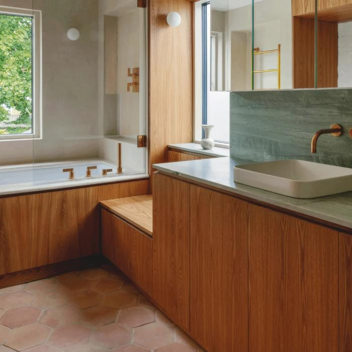 Hexagonal terracotta tiles in a wooden bathroom