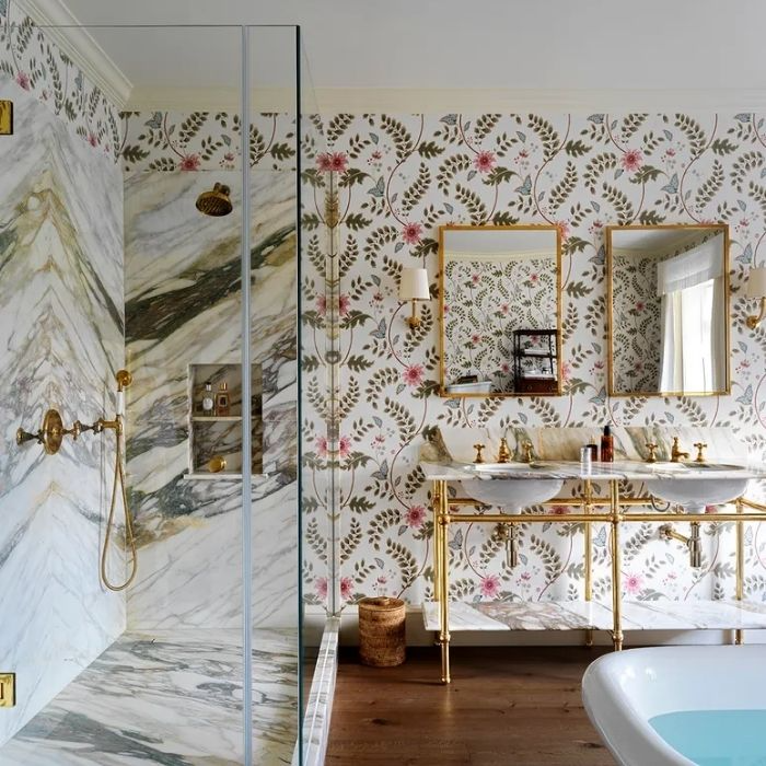 Marble shower and floral wallpaper in an elegant bathroom