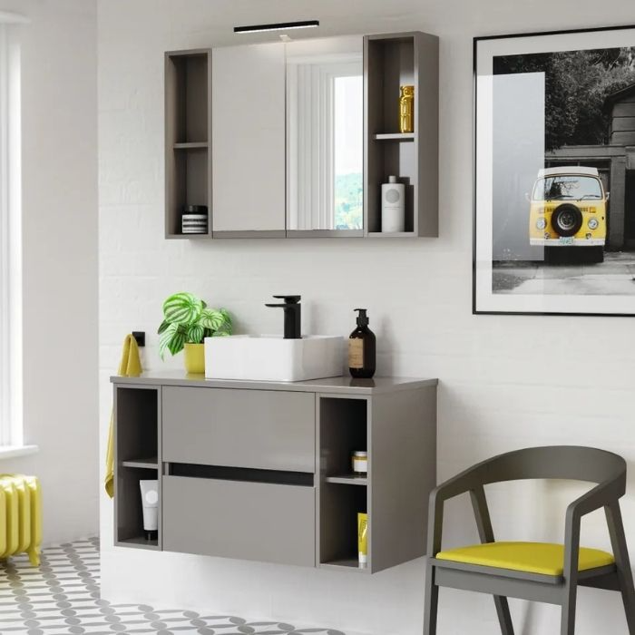 Grey vanity with black tap and yellow accents