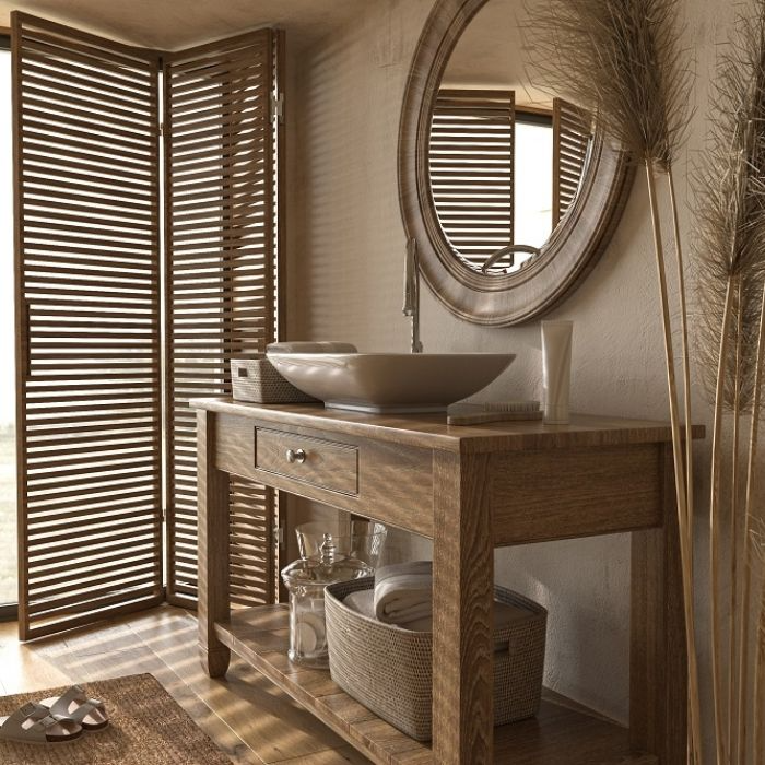 Rustic bathroom with wooden vanity and round mirror