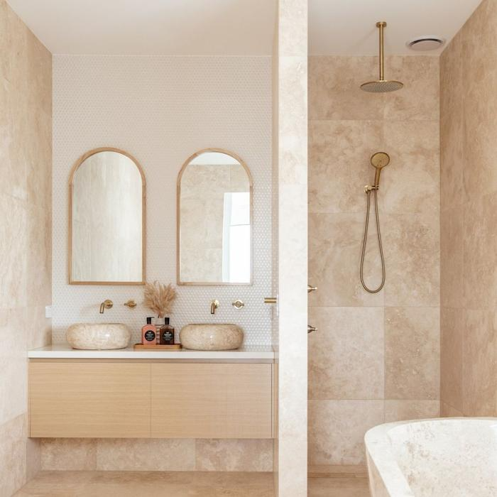 Beige stone tiles in a bright bathroom