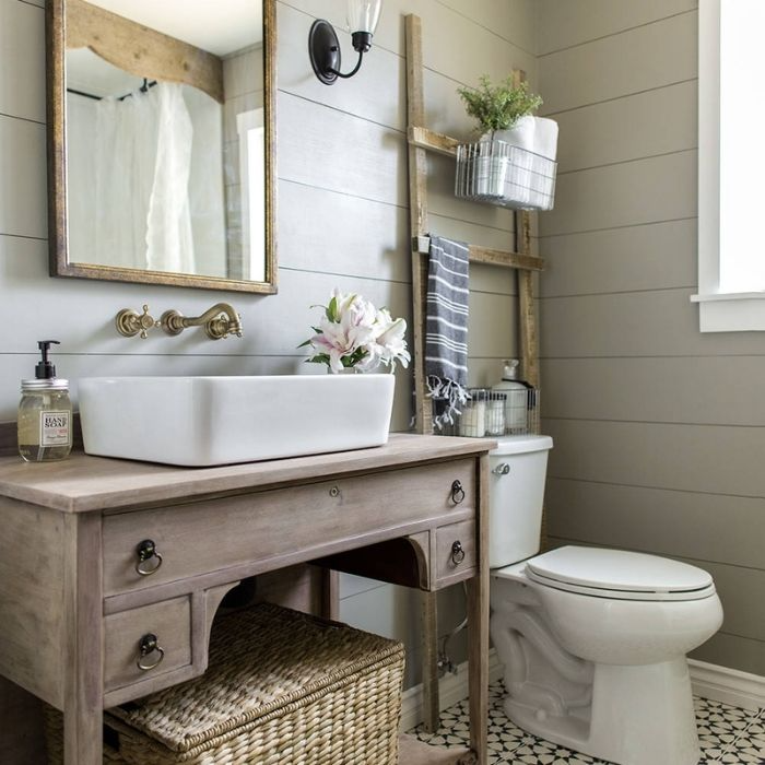 Country bathroom with a vintage-style vanity and patterned floor tiles