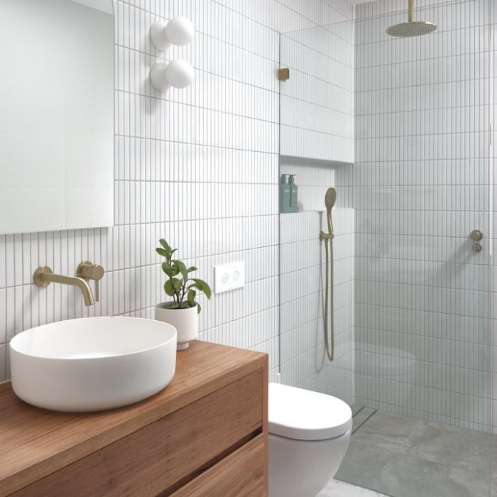 Slim vertical white tiles and wooden vanity in bathroom