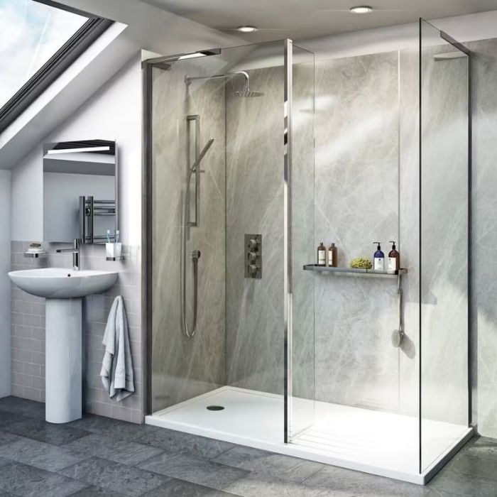 Large grey marble tiles with a spacious raised shower tray