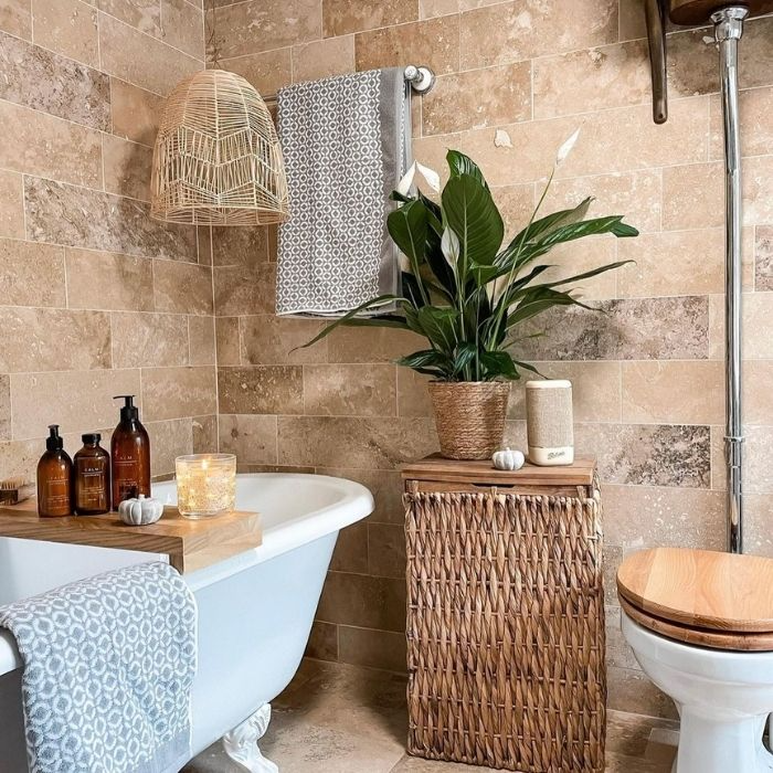 Rustic bathroom with natural stone tiles and woven accents