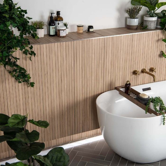 Bathroom with herringbone floor and wooden slatted feature wall