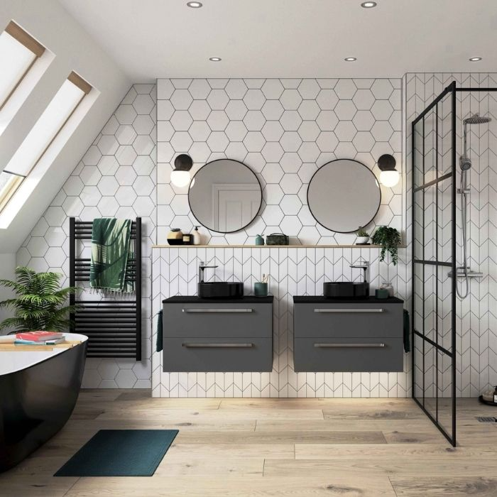 White hexagon tiles with black accents in a contemporary bathroom