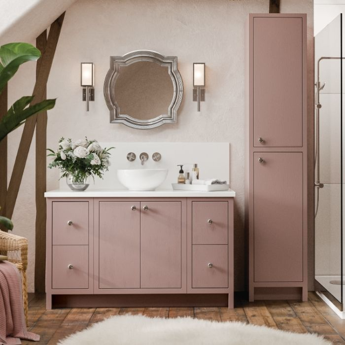 Rustic pink vanity with silver mirror and wooden floor