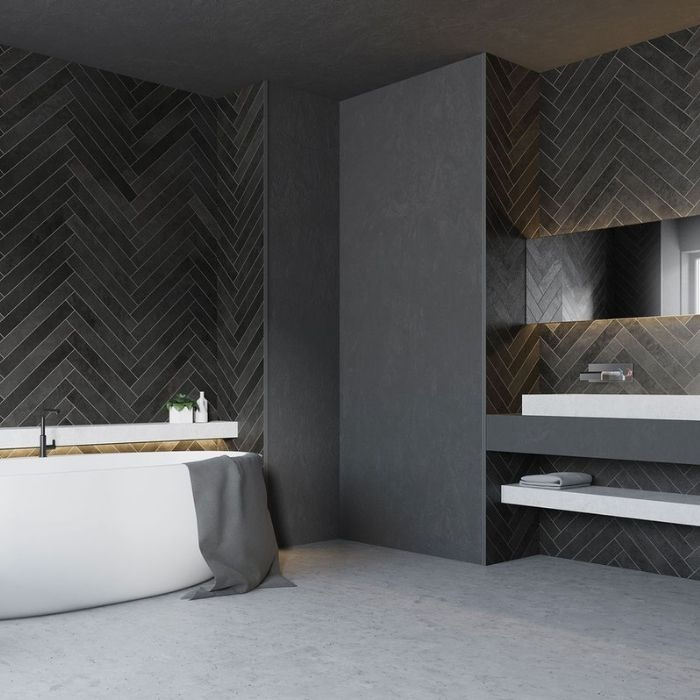 Dark herringbone tiles in a contemporary bathroom