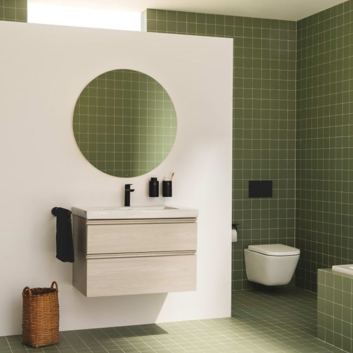 Soft green square tiles in a minimalist bathroom