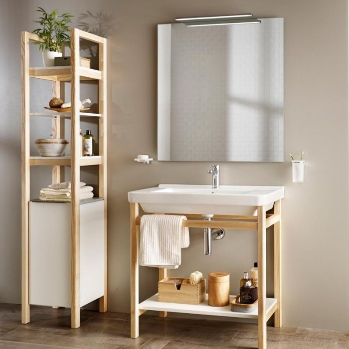 Light wood shelving and simple white tiles in bathroom